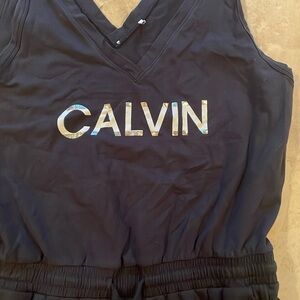 a size large romper super soft black with graphic on the front and pockets